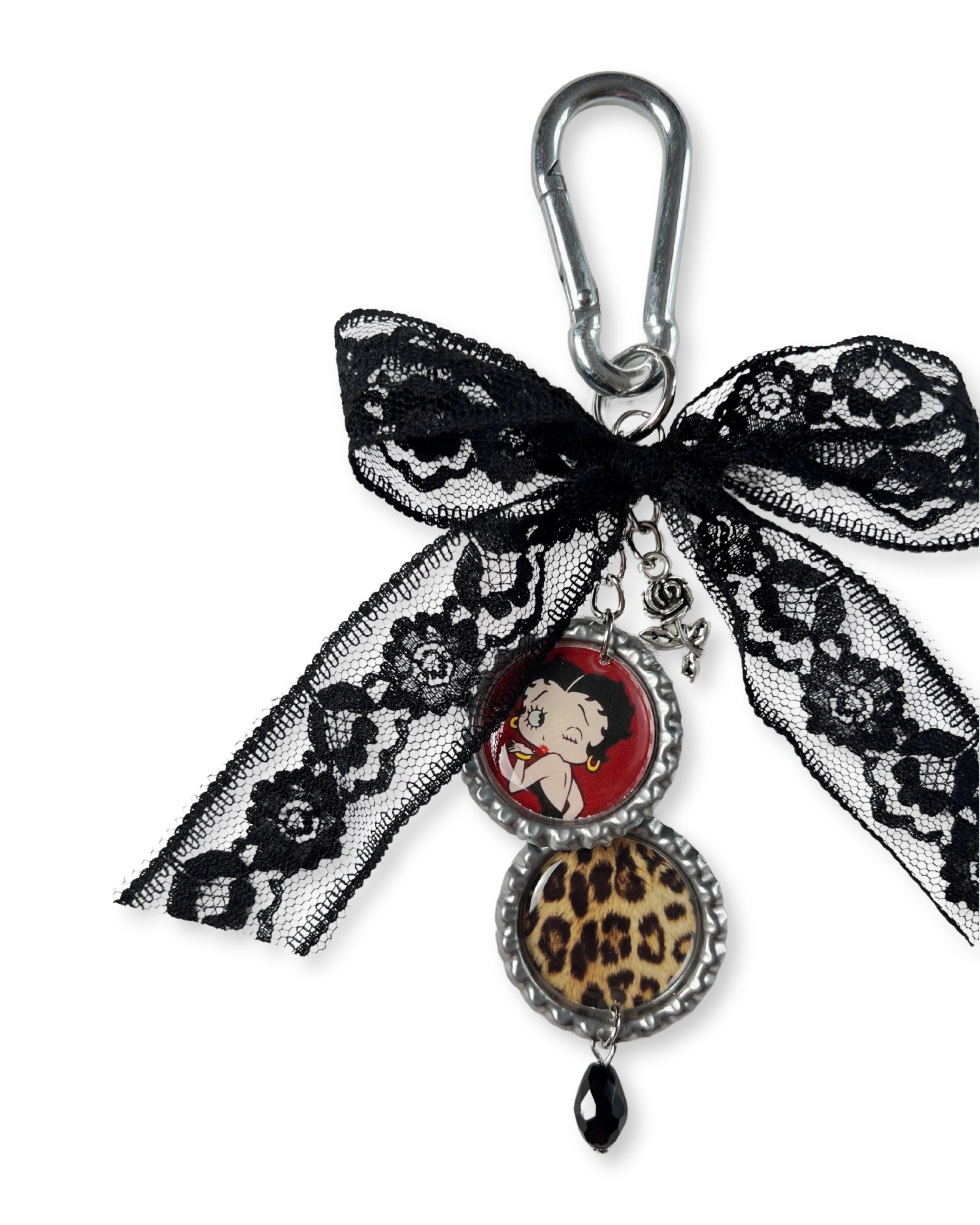Keychain with decorative bow and charm featuring a character, on a white background