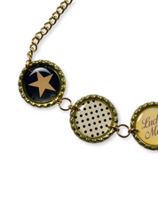 Bracelet with star and polka dot design on a white background