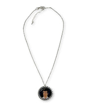 Necklace with a pendant featuring a portrait on a white background