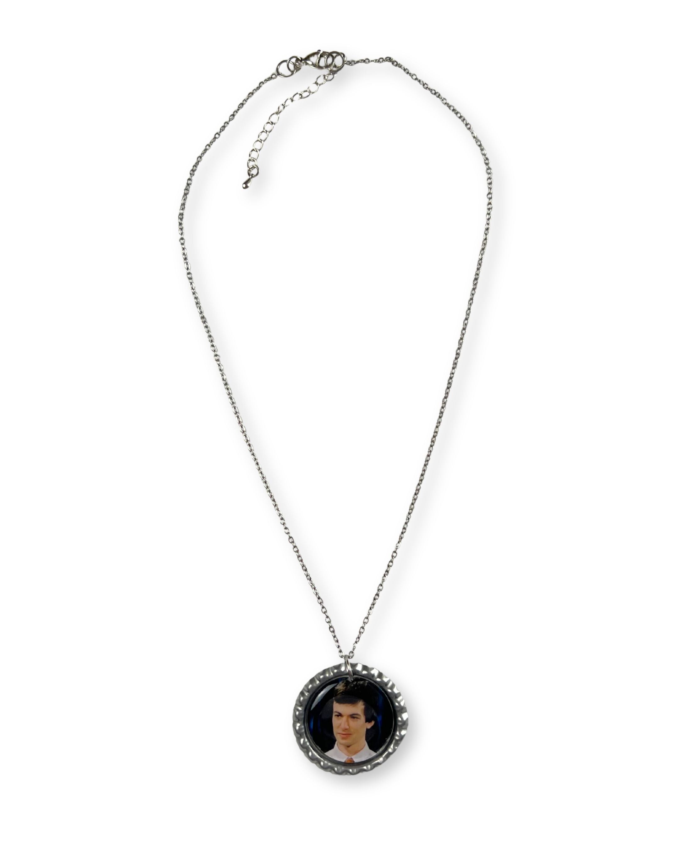 Necklace with a pendant featuring a portrait on a white background
