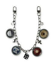 Keychain with various charms on a white background