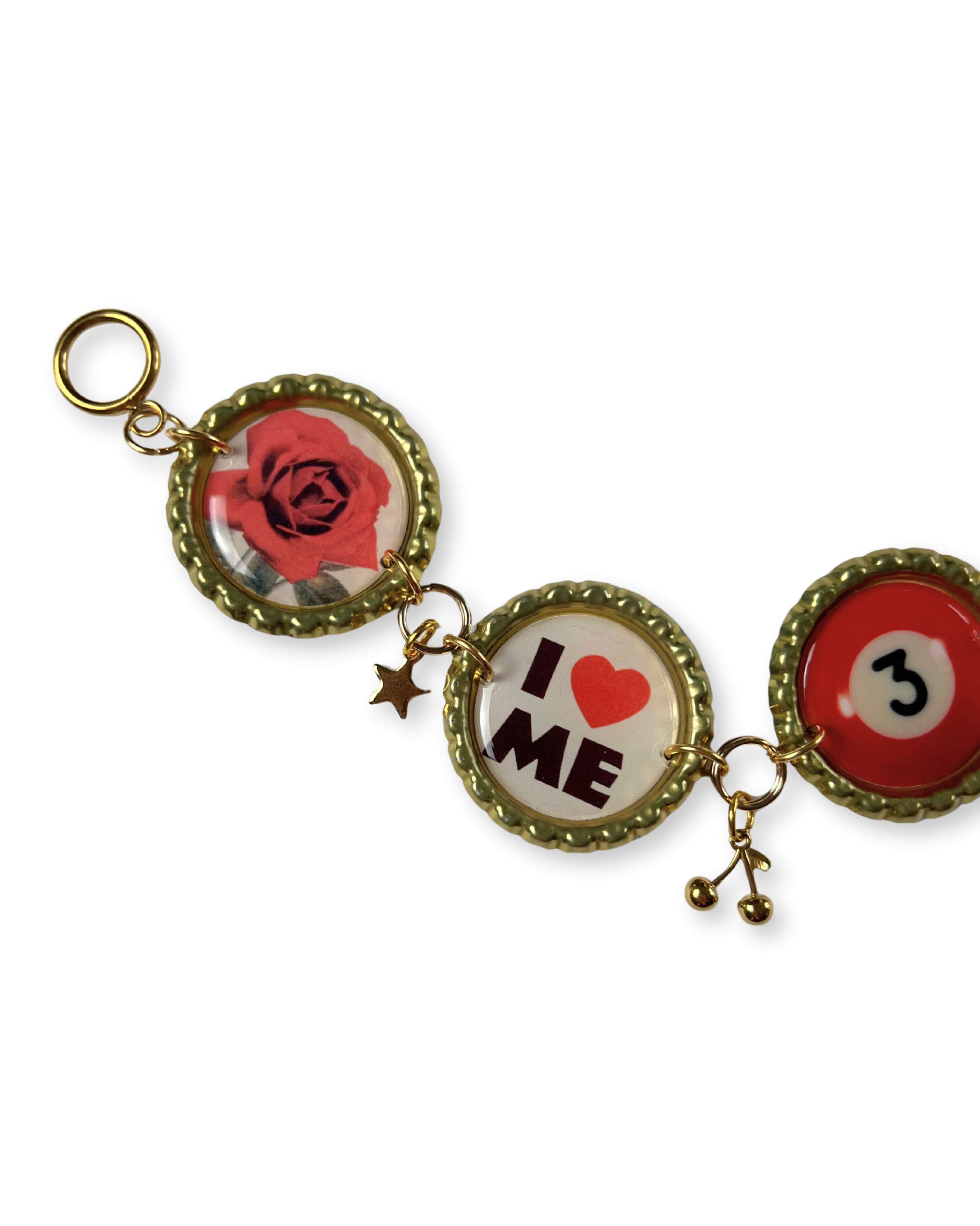 Decorative keychain with circular charms featuring a rose, 'I ❤️ ME', and number 3 on a white background.