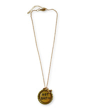 Gold necklace with a pendant that says 'HOT SHIT!!!'