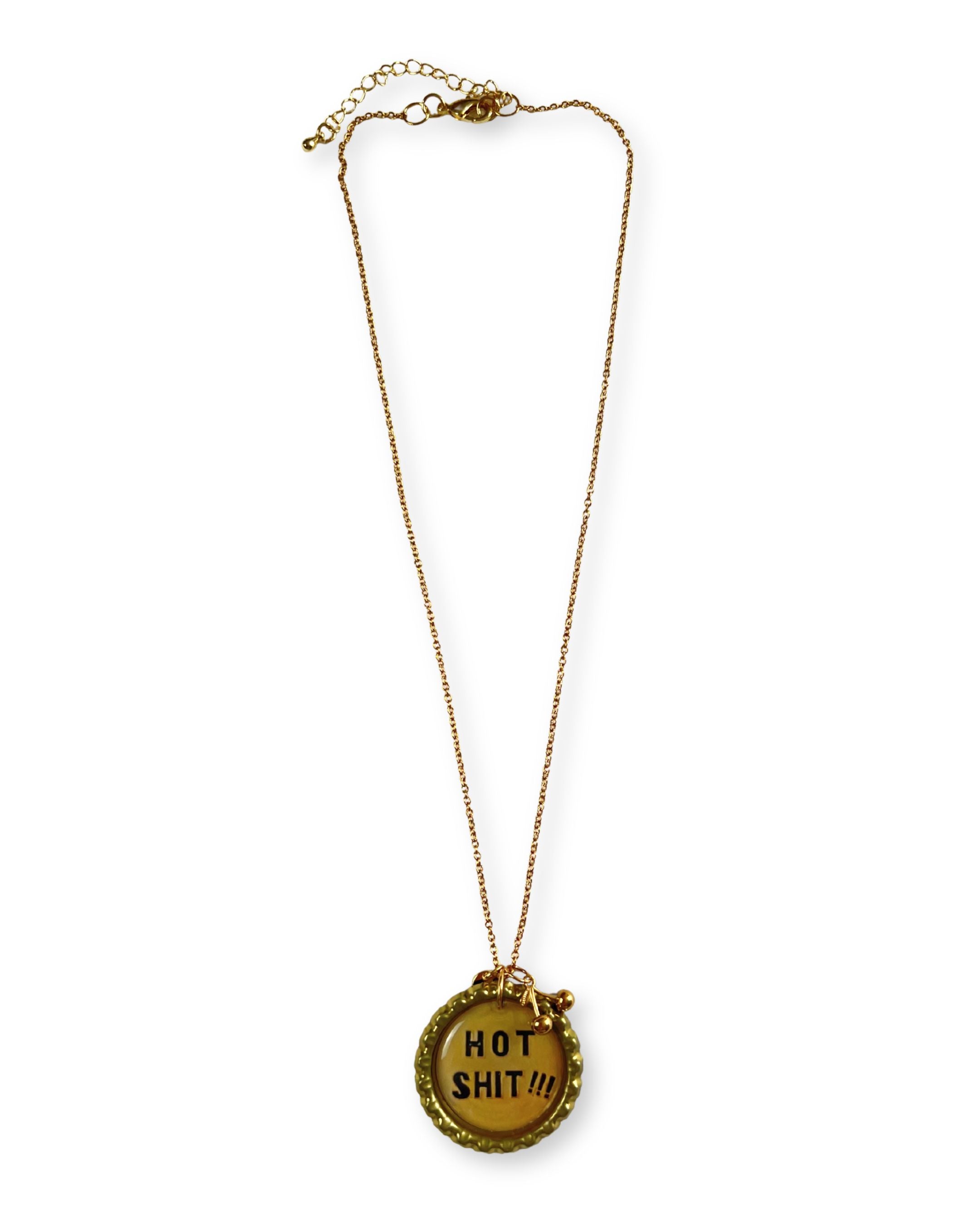 Gold necklace with a pendant that says 'HOT SHIT!!!'