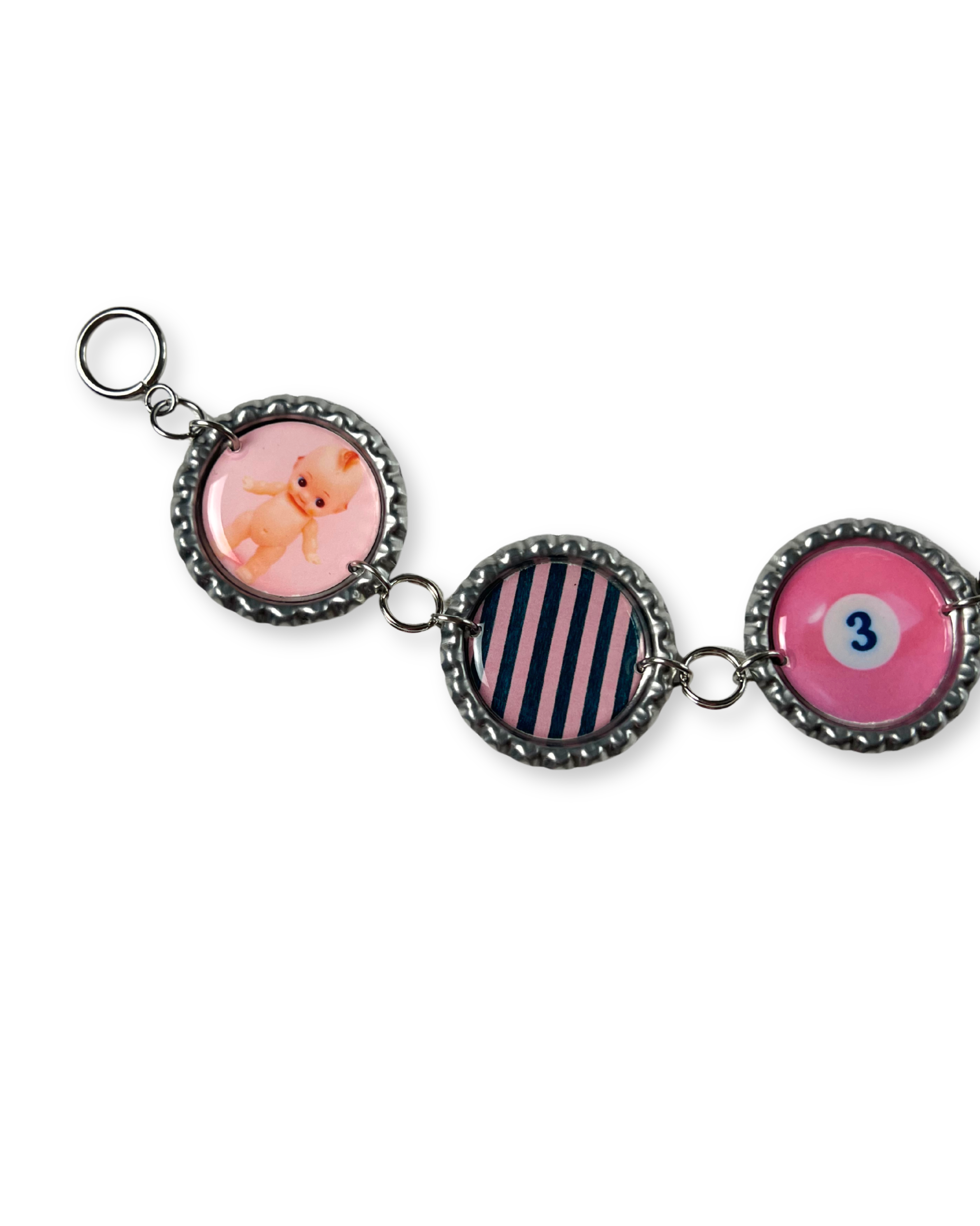Keychain with three circular charms featuring different designs on a white background