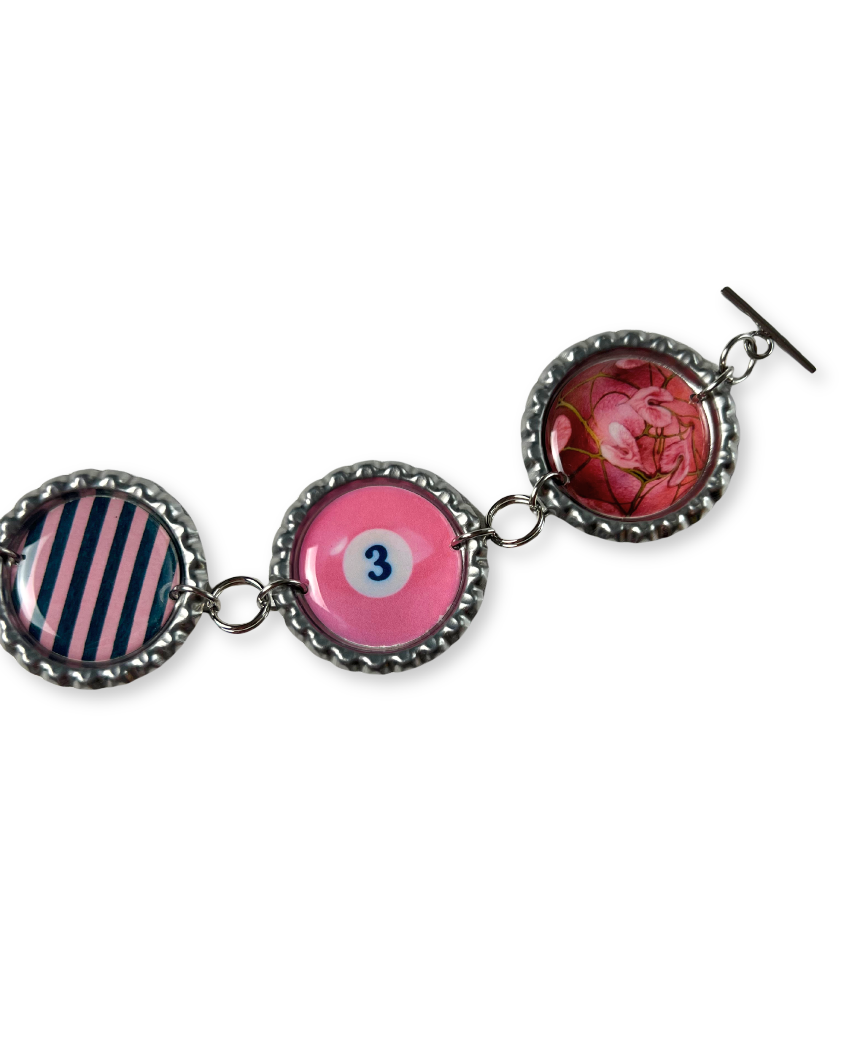Bracelet with three circular charms featuring different designs on a white background