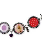Bracelet with circular charms featuring different designs on a white background