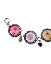 Keychain with circular charms featuring different designs on a white background