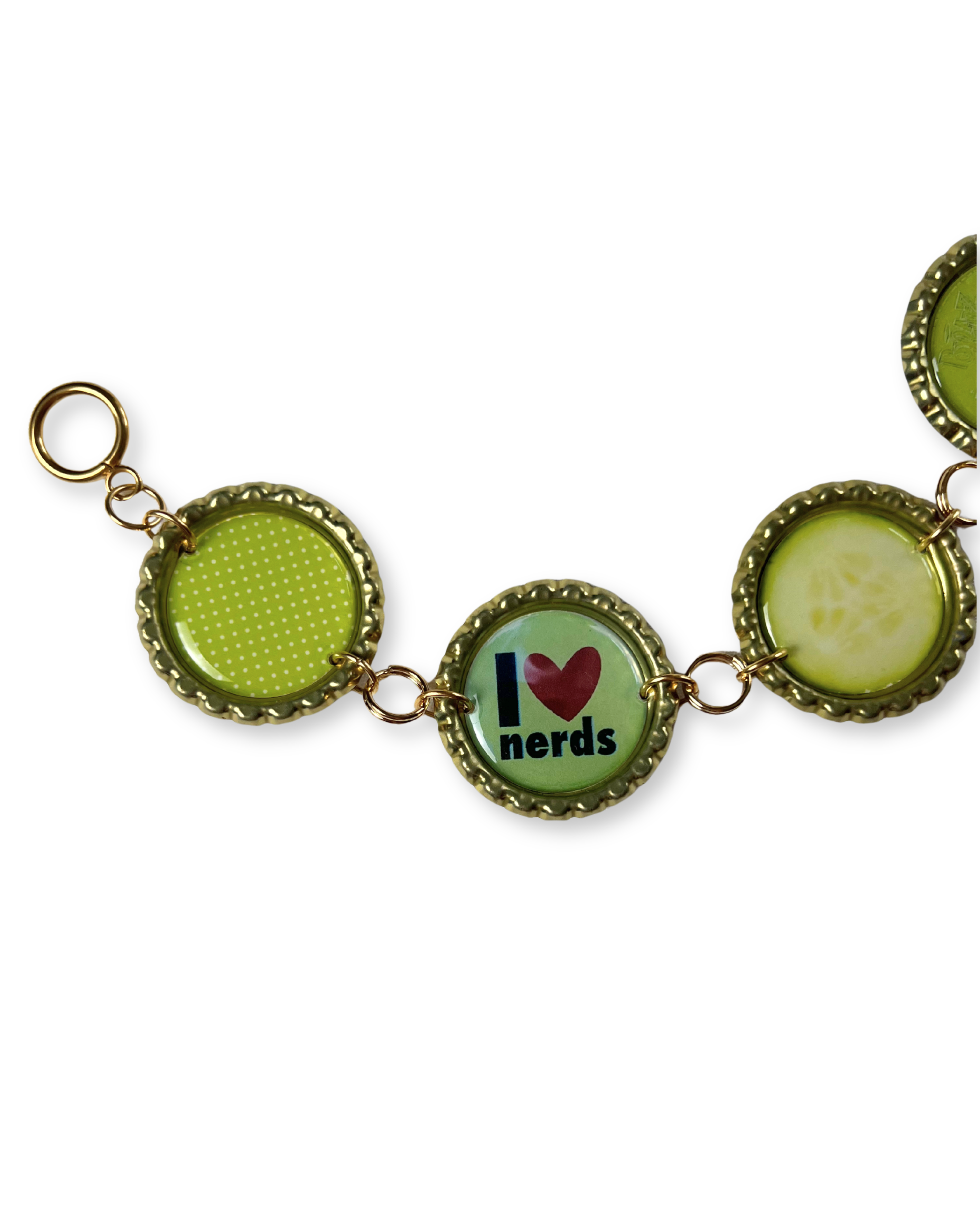 Bracelet with green and gold charms on a white background