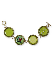 Bracelet with green circular charms on a white background